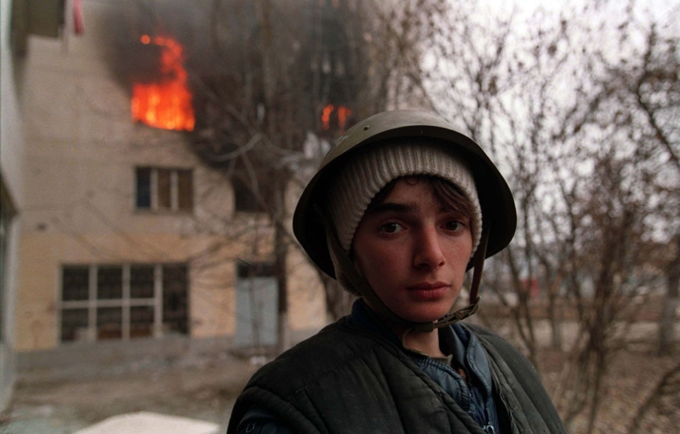 A Chechen stands in the street during the battle for Grozny January 1995 Mikhail Evstafiev