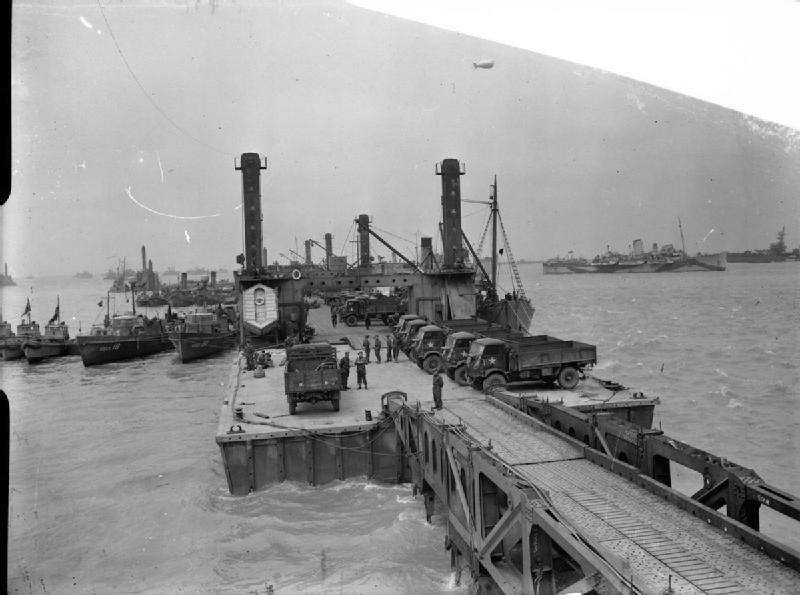 Mulberry Harbour Arromanches. Lorries on the Spud Pierhead L. Pelman