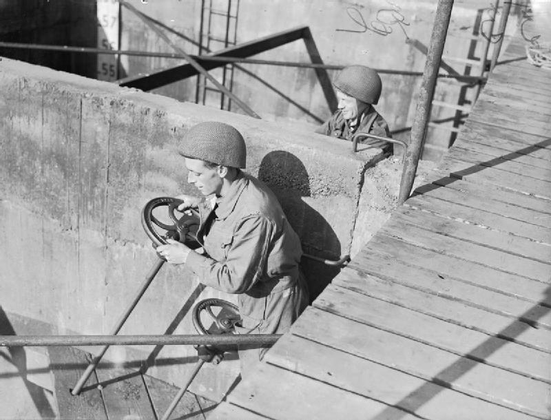 Royal Engineers Sappers operating the valves of one of the Phoenixes to submerge it after it has been placed in position L. Pelman